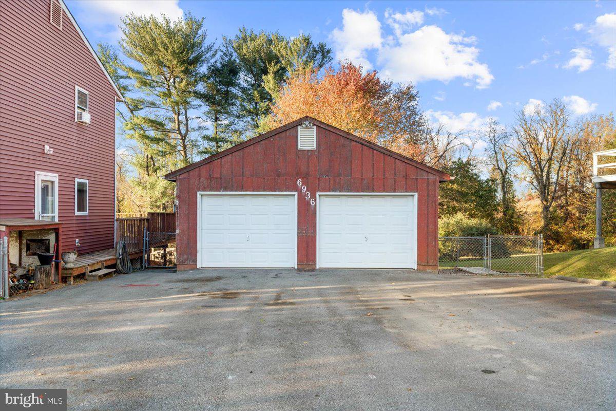 6936 Linganore Road Frederick, MD 21701 - Photo 3 of 33 a view of a house with a yard and garage