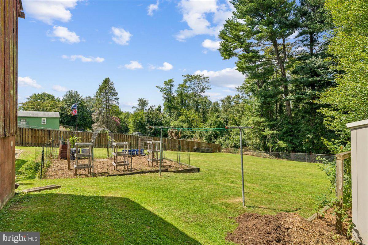 6936 Linganore Road Frederick, MD 21701 - Photo 33 of 33 a view of a chair and tables with the garden