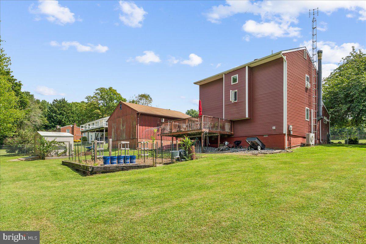 6936 Linganore Road Frederick, MD 21701 - Photo 4 of 33 a view of a house with a big yard plants and large trees