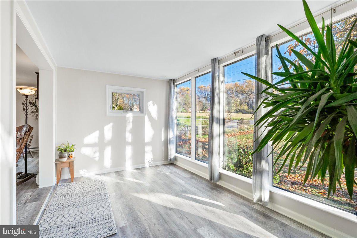 6936 Linganore Road Frederick, MD 21701 - Photo 8 of 33 a view of an entryway with wooden floor and door