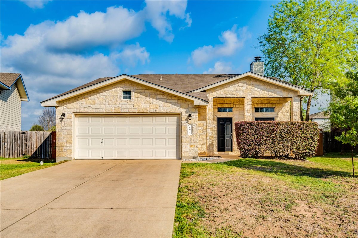 a front view of a house with a yard