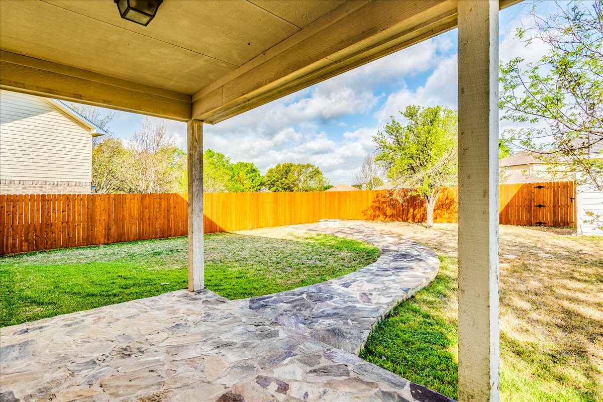 267 Carolyns Way Buda, TX 78610 - Photo 27 of 31 a view of a porch with a yard