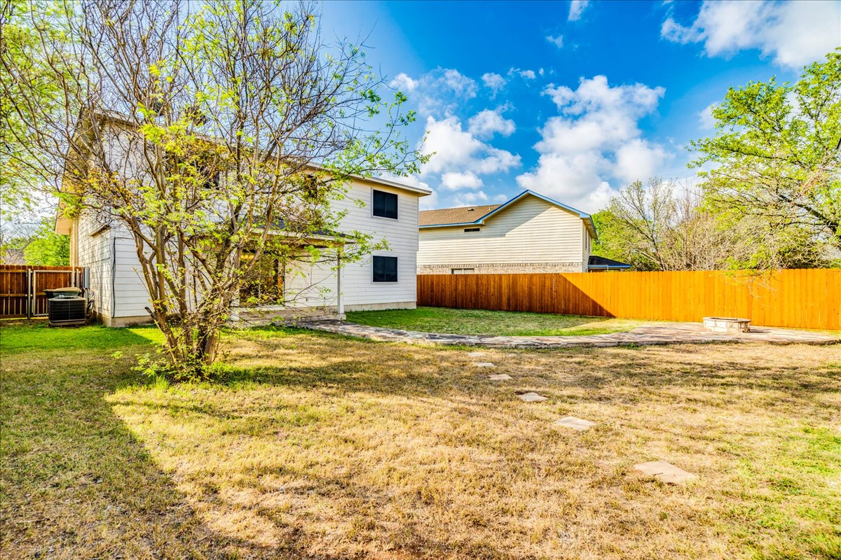 267 Carolyns Way Buda, TX 78610 - Photo 29 of 31 a view of a house with a yard