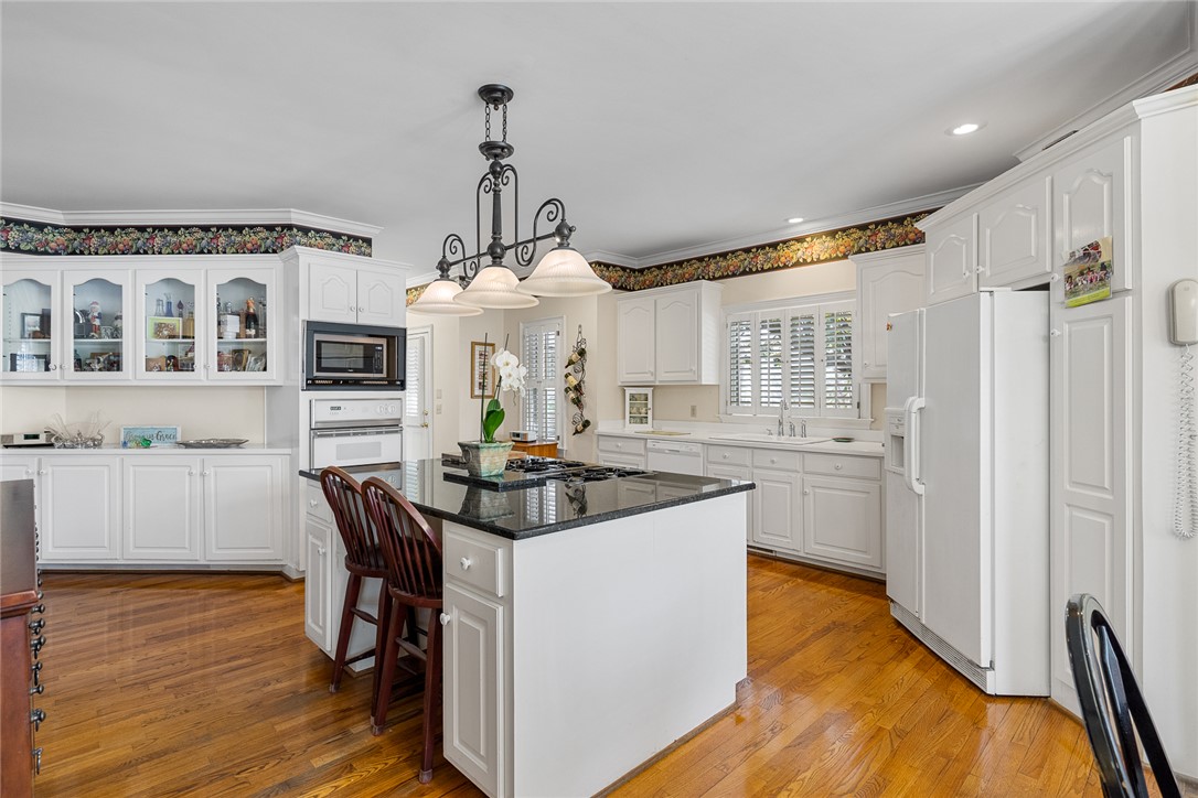4011 Brackenberry Drive Anderson, SC 29621 - Photo 12 of 35 This spacious kitchen offers ample cabinet storage and an inviting central island for culinary endeavors.