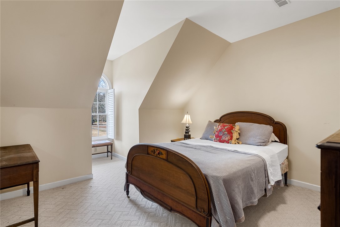 4011 Brackenberry Drive Anderson, SC 29621 - Photo 23 of 35 This spacious bedroom offers abundant natural light and features charming architectural details.