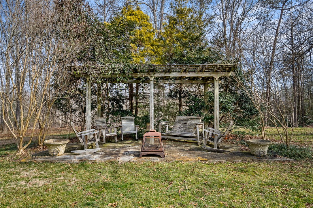 4011 Brackenberry Drive Anderson, SC 29621 - Photo 32 of 35 Relax in this peaceful outdoor space, perfect for quiet moments or lively gatherings.