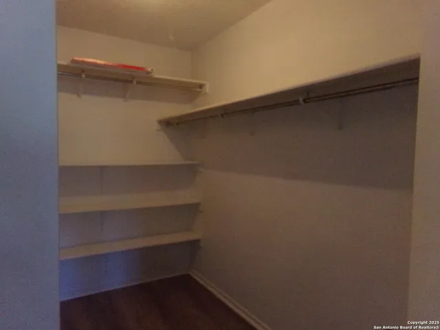 a view of an empty walk in closet