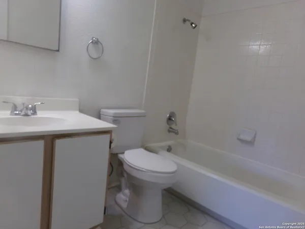 a bathroom with a sink toilet and bathtub