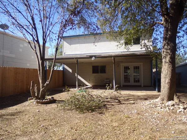 a house with trees in front of it