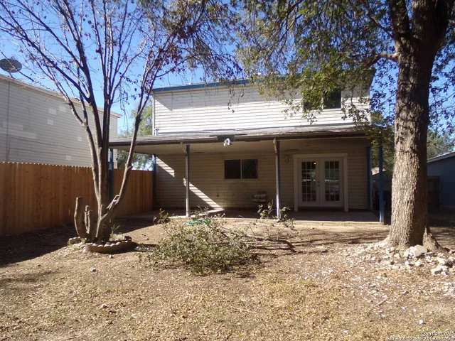 a house with trees in front of it