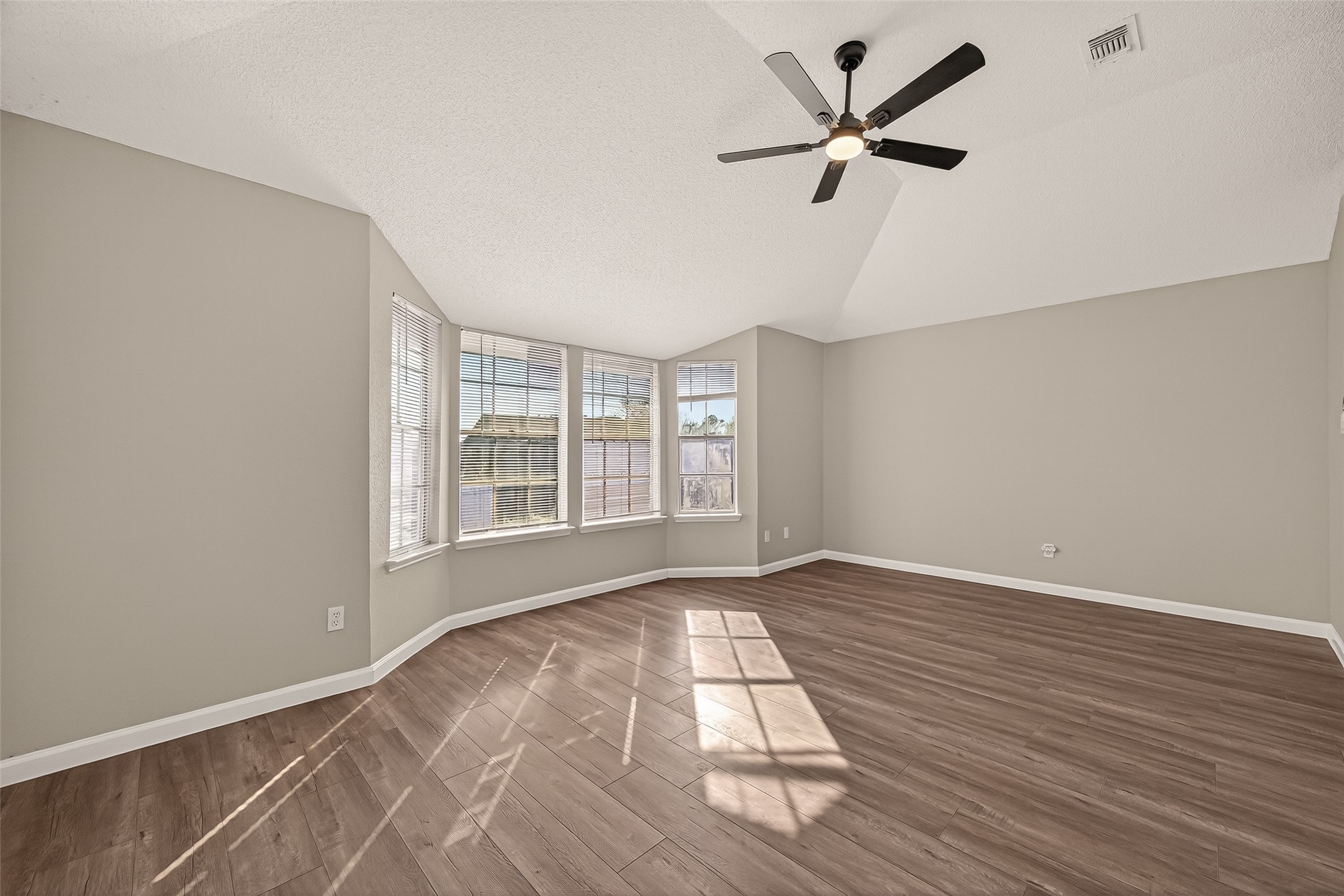 7622 Poitiers Drive Houston, TX 77071 - Photo 18 of 37 wooden floor in an empty room with a window