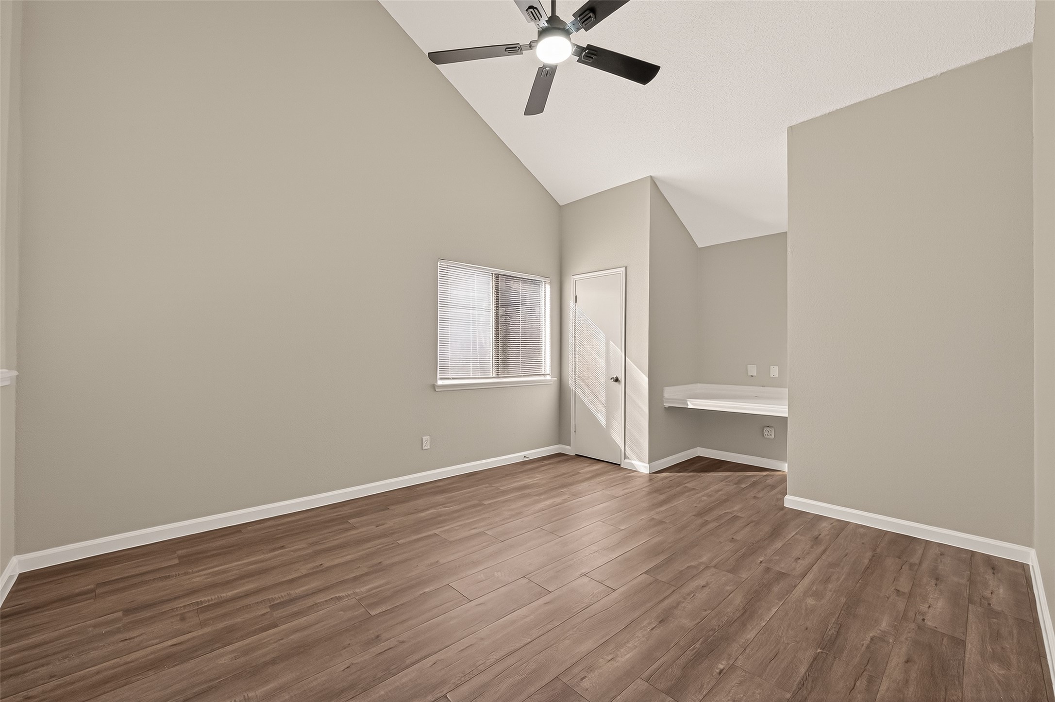 7622 Poitiers Drive Houston, TX 77071 - Photo 23 of 37 a view of an empty room with wooden floor and a ceiling fan