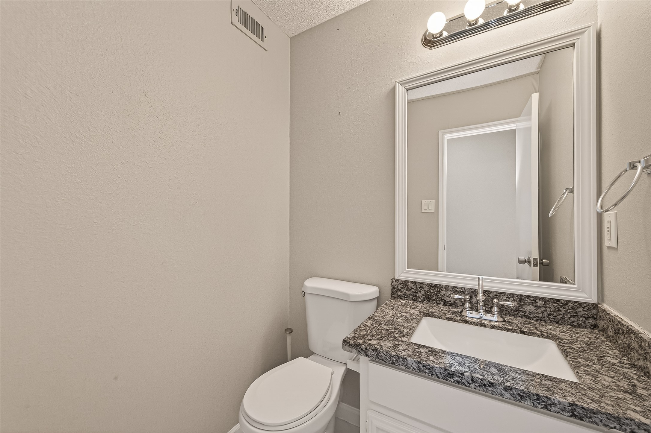 7622 Poitiers Drive Houston, TX 77071 - Photo 36 of 37 a bathroom with a granite countertop toilet sink and mirror