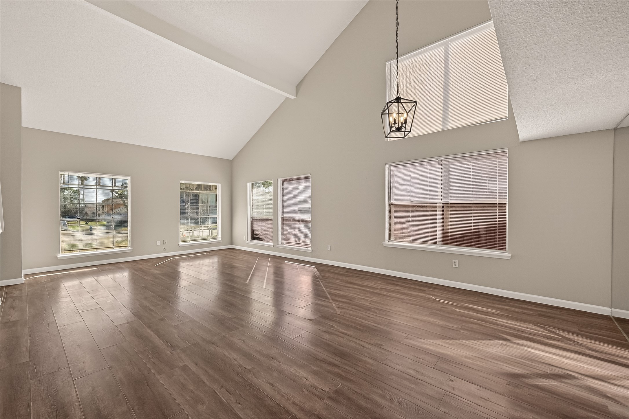 7622 Poitiers Drive Houston, TX 77071 - Photo 5 of 37 a view of an empty room with wooden floor and a window