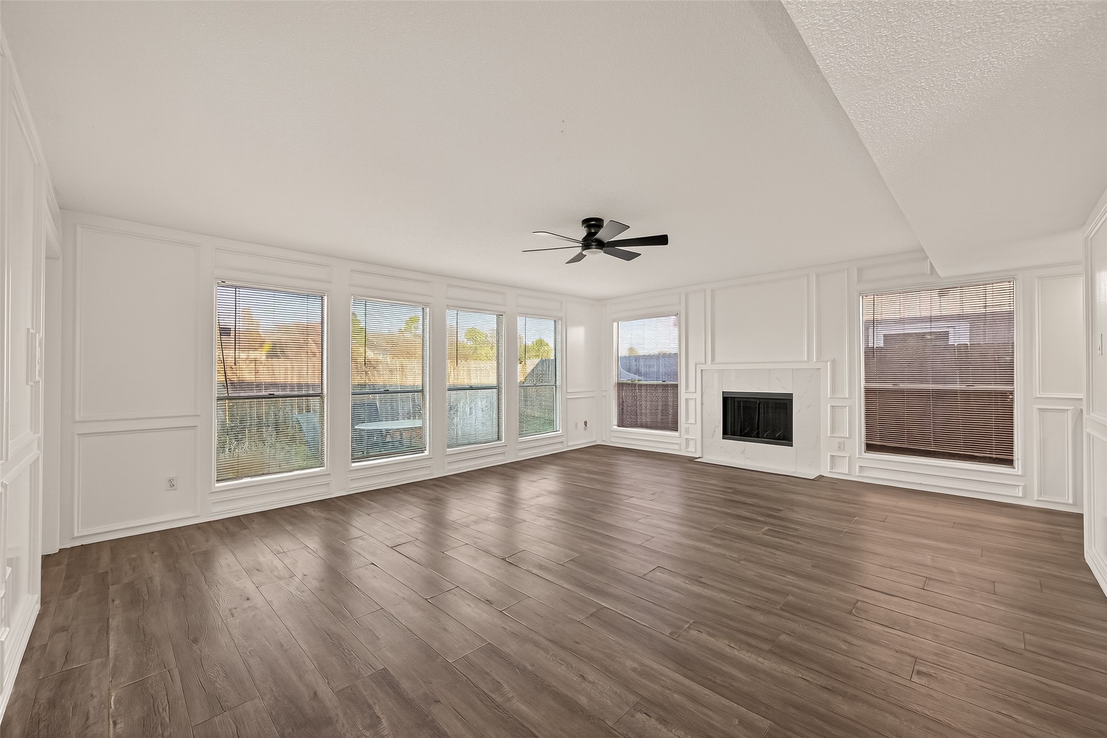 7622 Poitiers Drive Houston, TX 77071 - Photo 6 of 37 a view of an empty room with wooden floor and a window