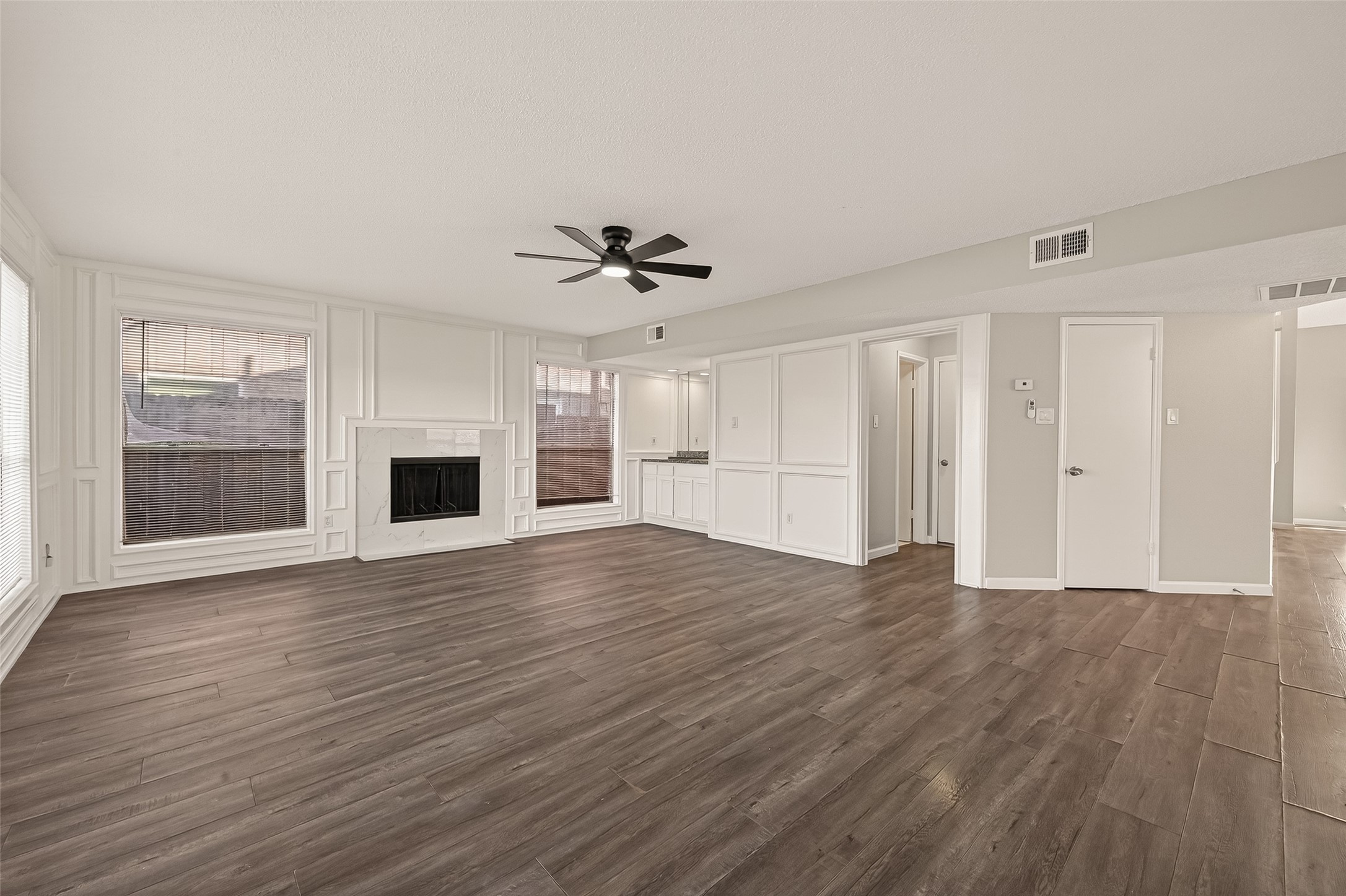 7622 Poitiers Drive Houston, TX 77071 - Photo 7 of 37 a view of an empty room with a window and wooden floor