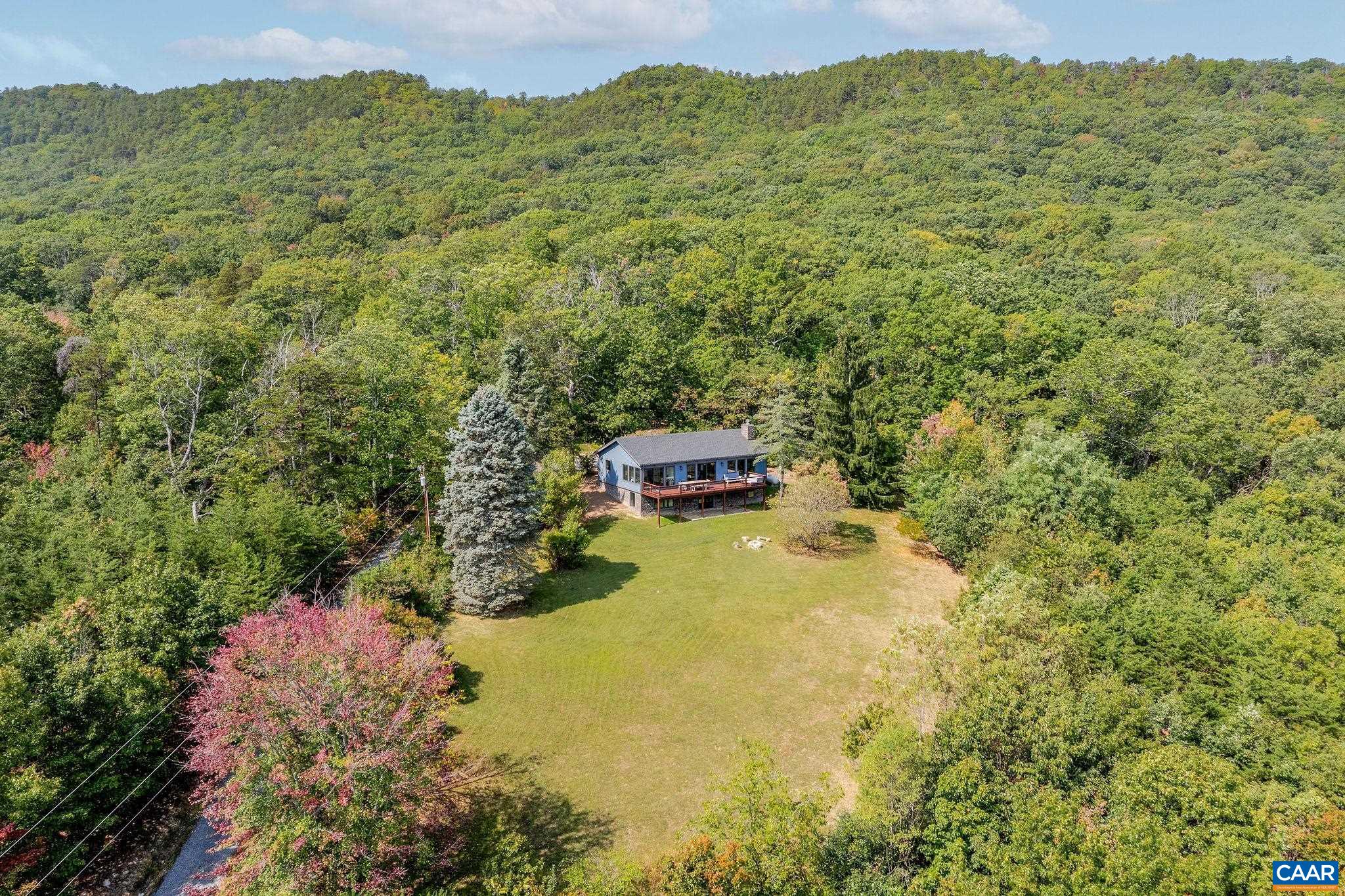 a view of a field with an trees