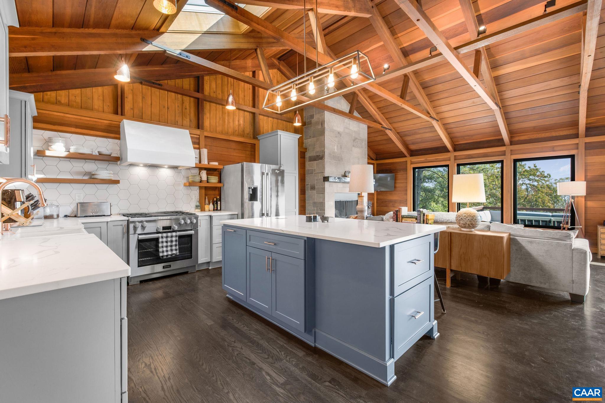 6288 Bryant Hollow Road Elkton, VA 22827 - Photo 15 of 54 a kitchen with stainless steel appliances granite countertop a sink and wooden cabinets