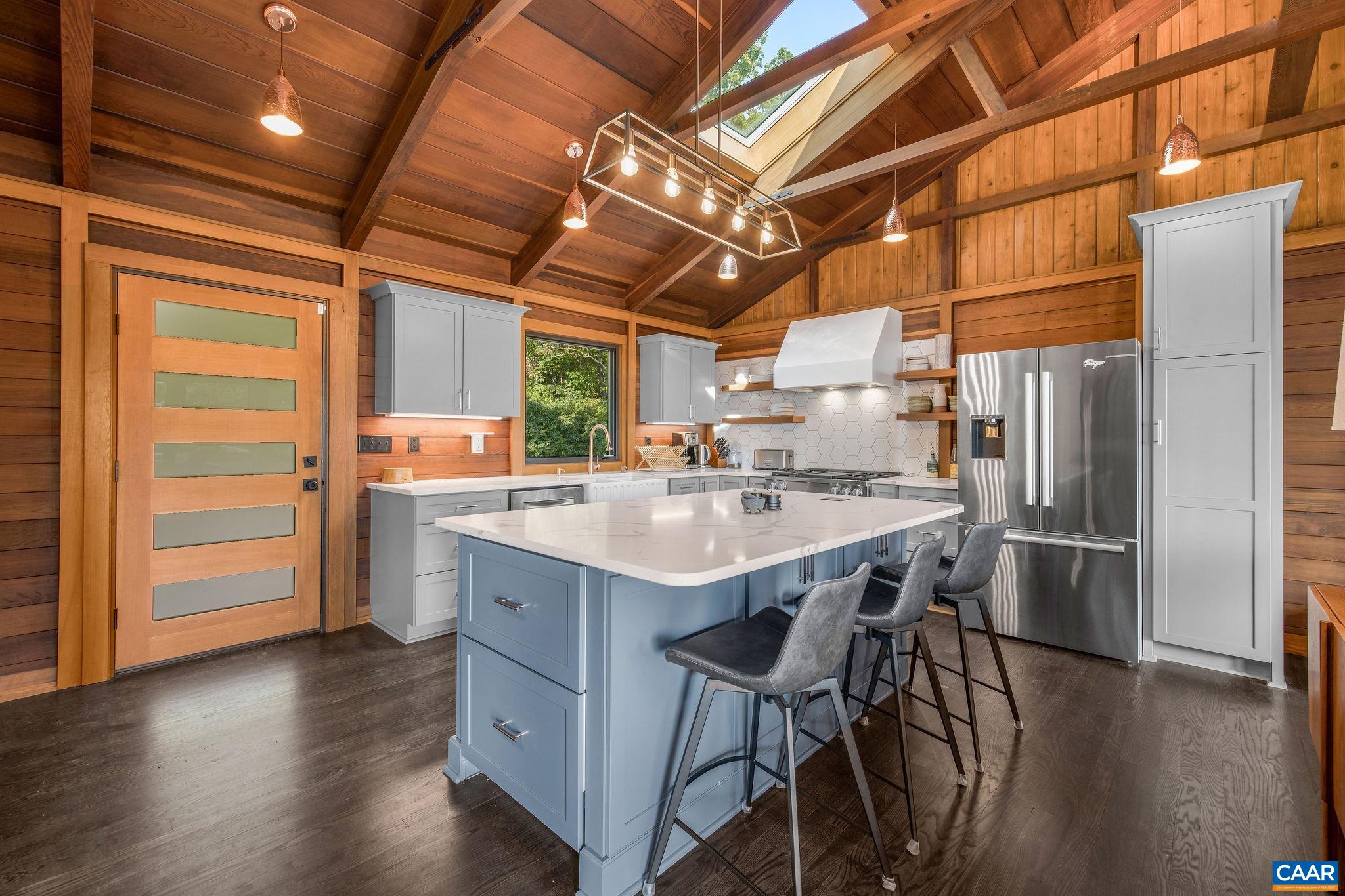 6288 Bryant Hollow Road Elkton, VA 22827 - Photo 16 of 54 a kitchen with kitchen island a sink stove and refrigerator