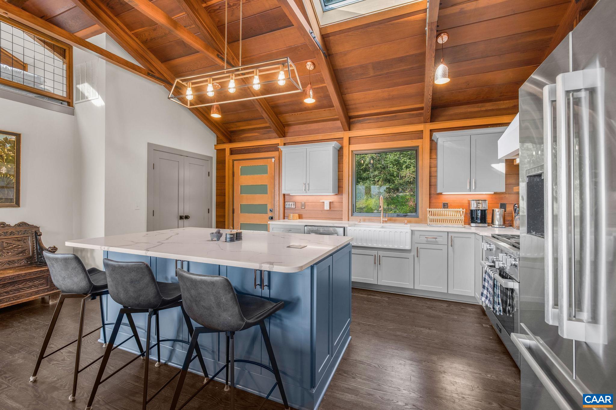 6288 Bryant Hollow Road Elkton, VA 22827 - Photo 17 of 54 a kitchen with a table chairs refrigerator and cabinets