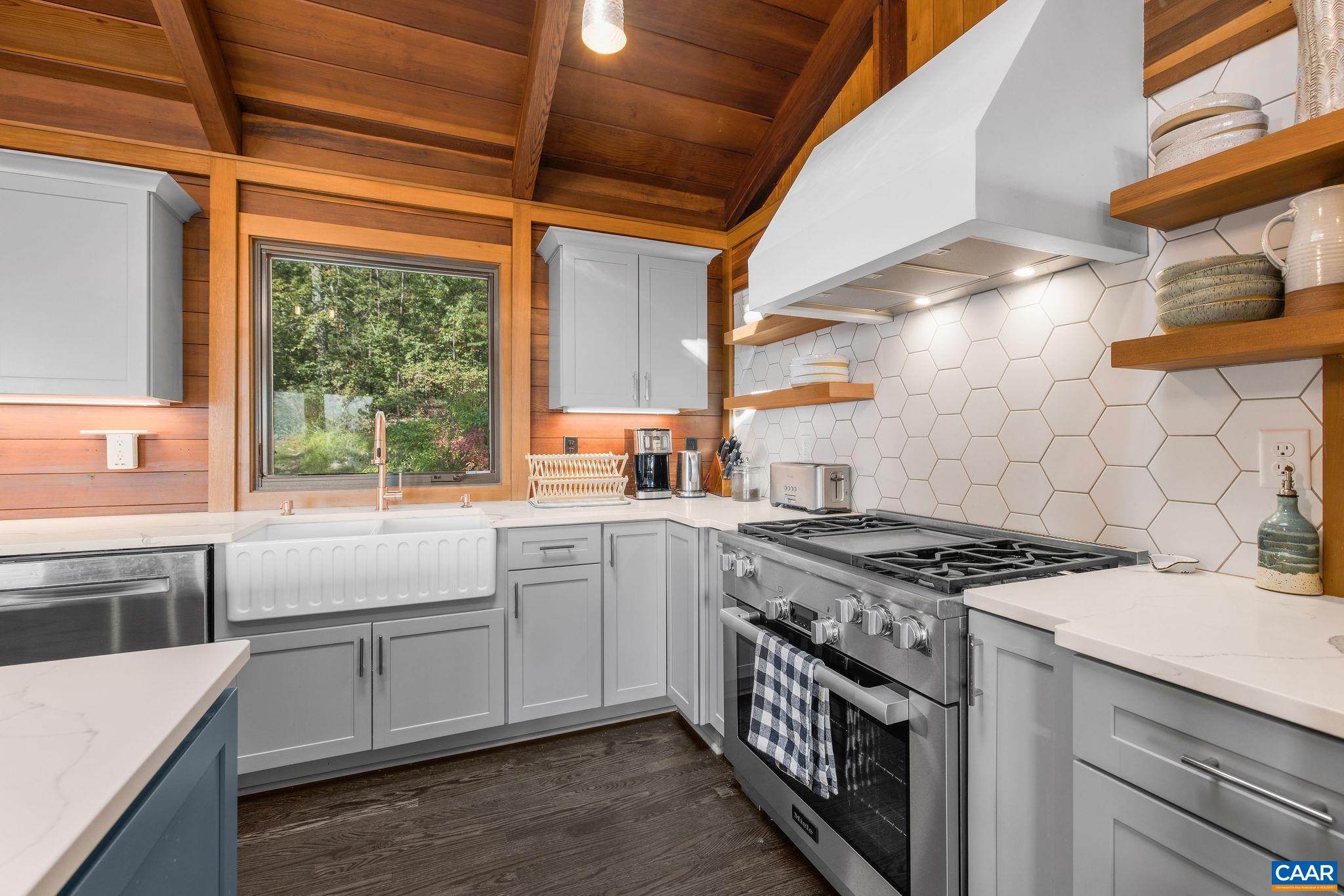 6288 Bryant Hollow Road Elkton, VA 22827 - Photo 19 of 54 a kitchen with a stove and a sink