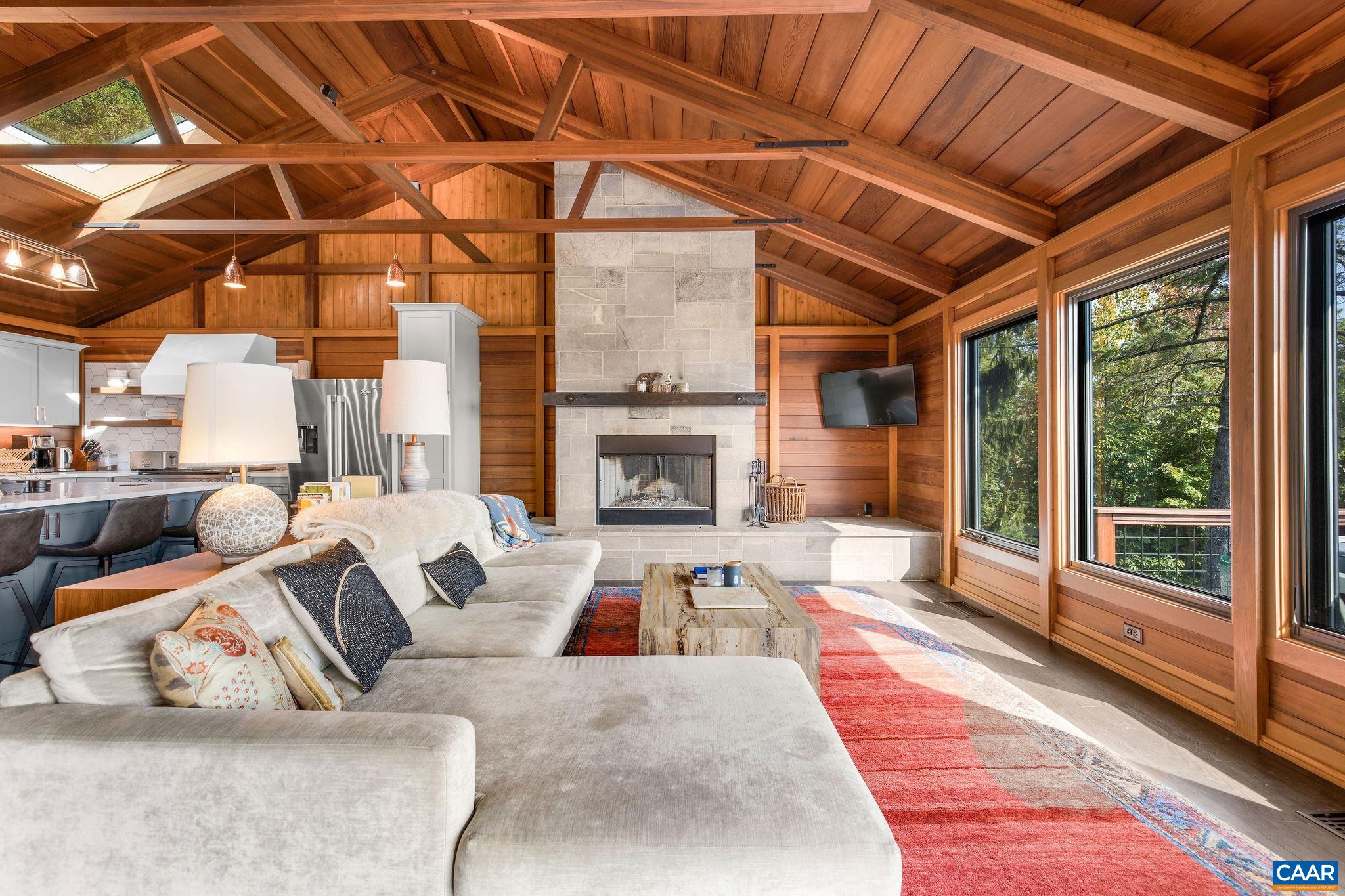 6288 Bryant Hollow Road Elkton, VA 22827 - Photo 20 of 54 a living room with furniture and a fireplace