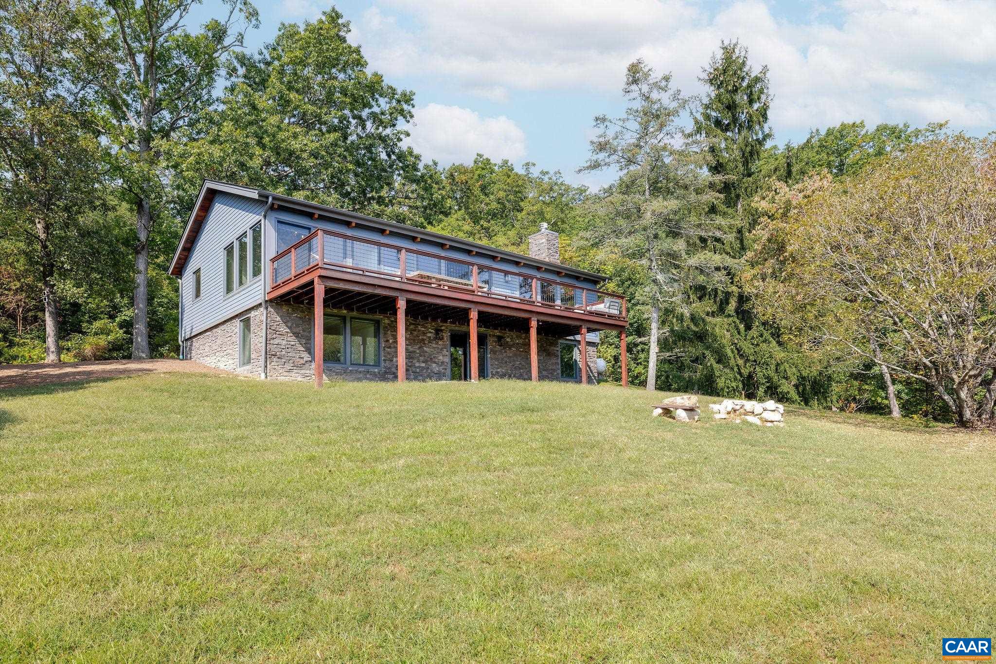 6288 Bryant Hollow Road Elkton, VA 22827 - Photo 2 of 54 a house with trees in the background