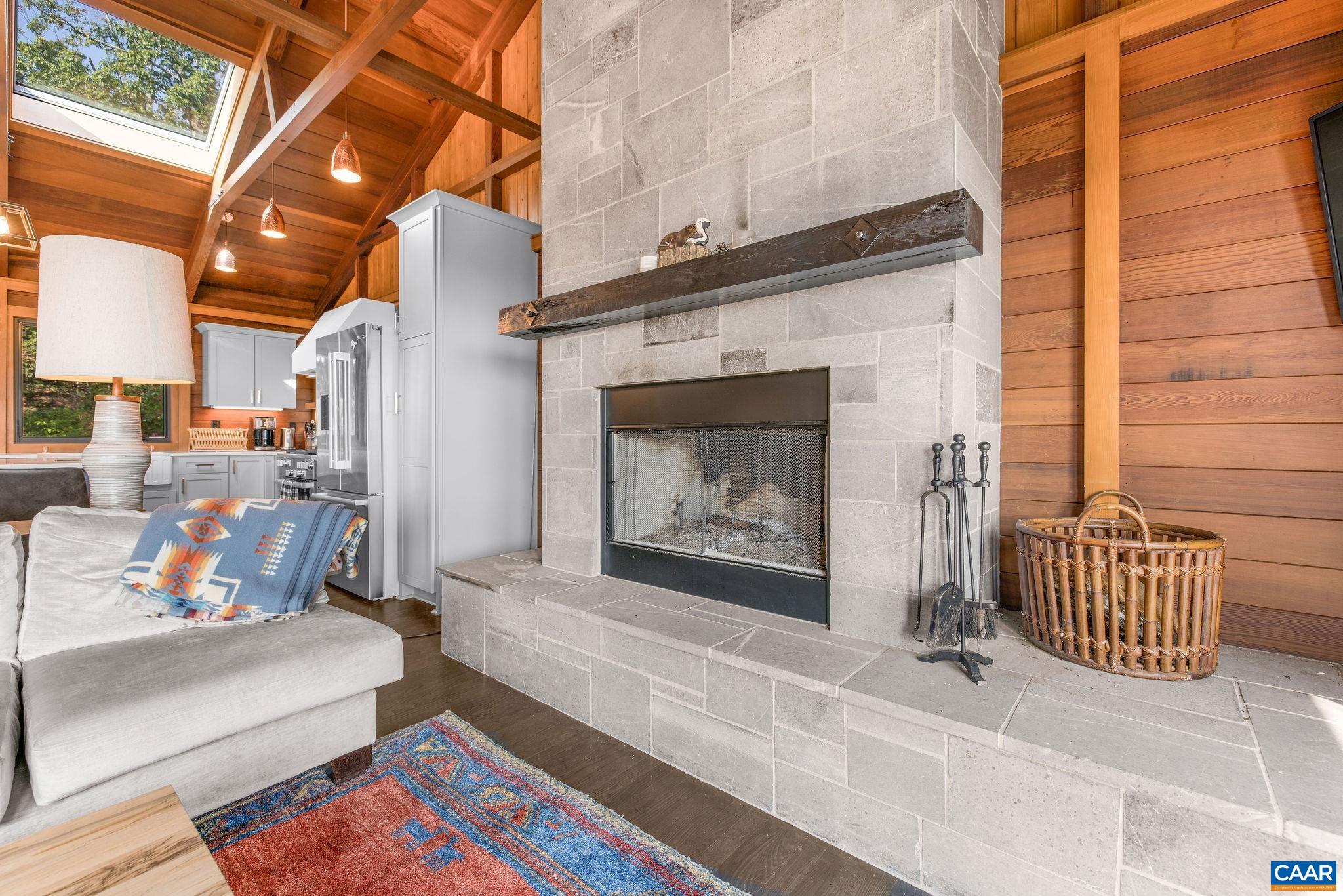 6288 Bryant Hollow Road Elkton, VA 22827 - Photo 21 of 54 a outdoor living space with furniture and a fireplace