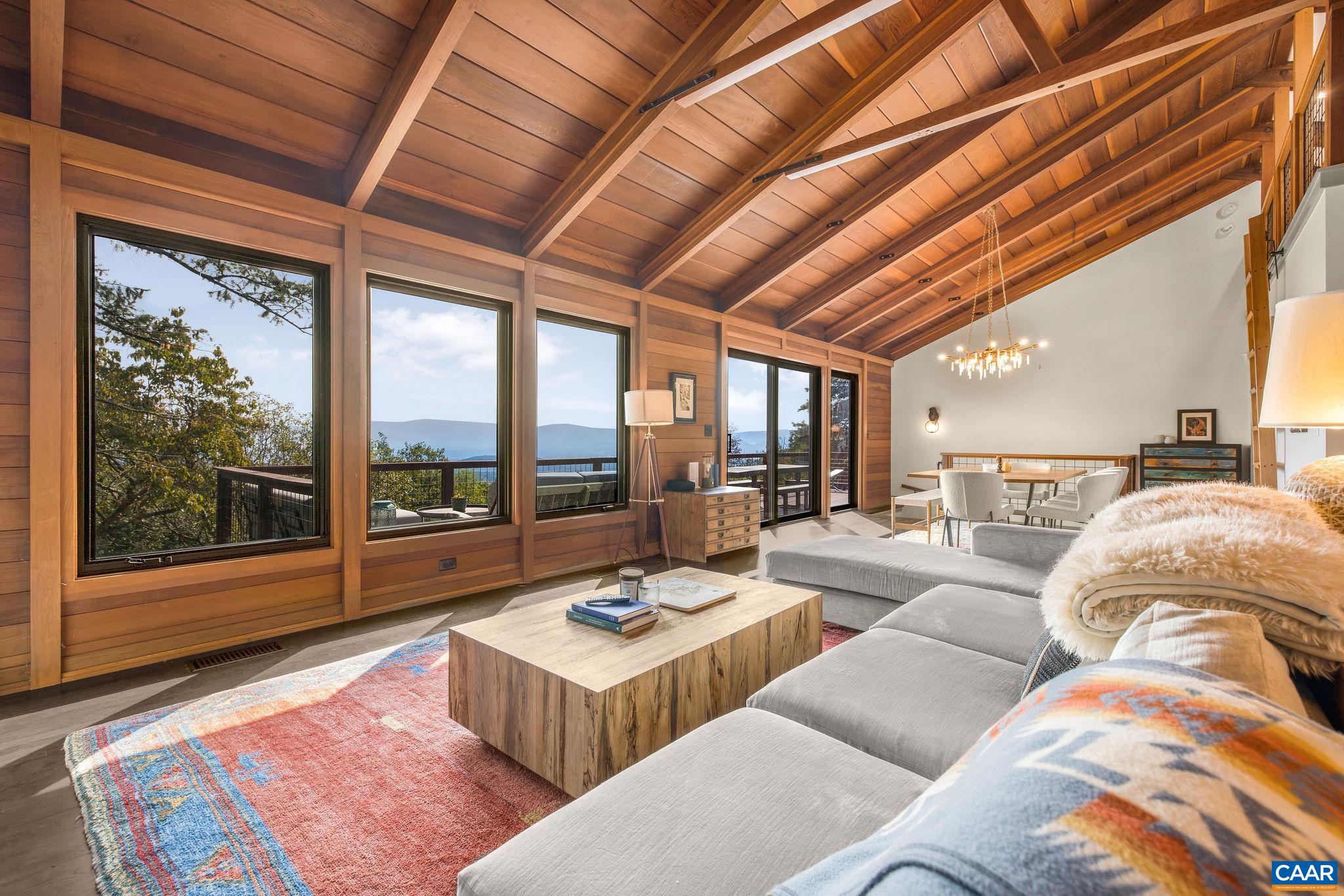6288 Bryant Hollow Road Elkton, VA 22827 - Photo 22 of 54 a living room with furniture and a large window