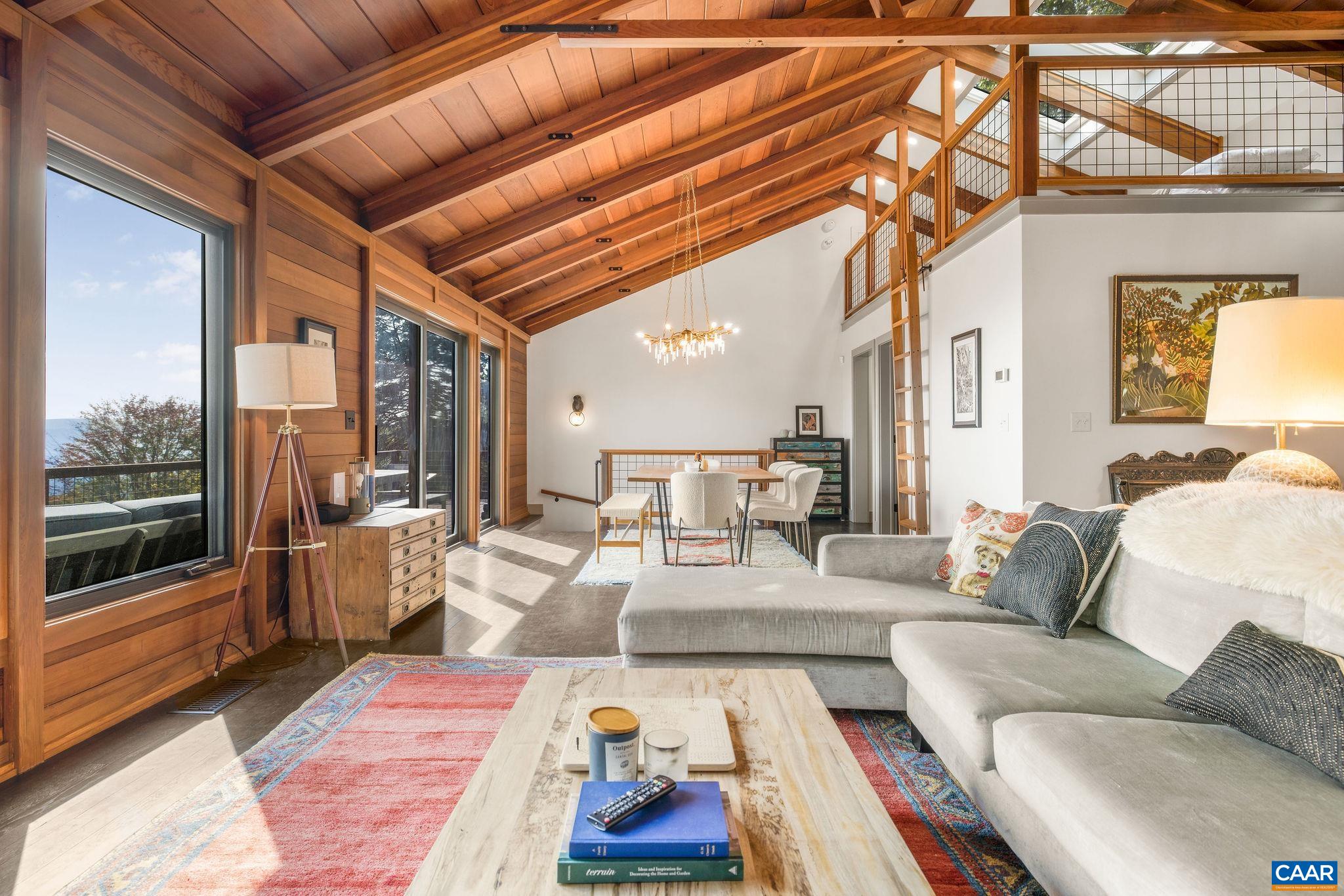 6288 Bryant Hollow Road Elkton, VA 22827 - Photo 24 of 54 a living room with furniture and a rug