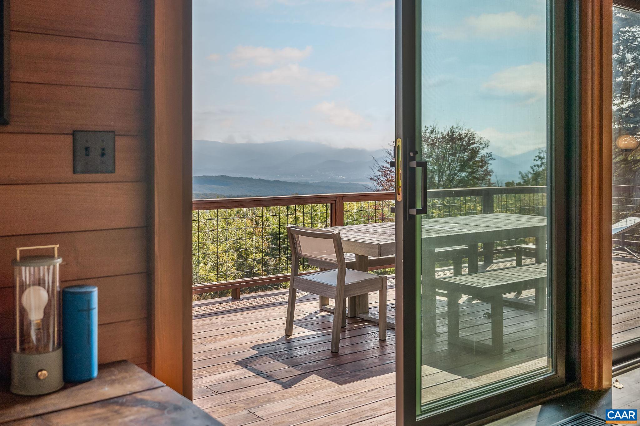 6288 Bryant Hollow Road Elkton, VA 22827 - Photo 28 of 54 a view of a room with wooden floor and floor to ceiling window