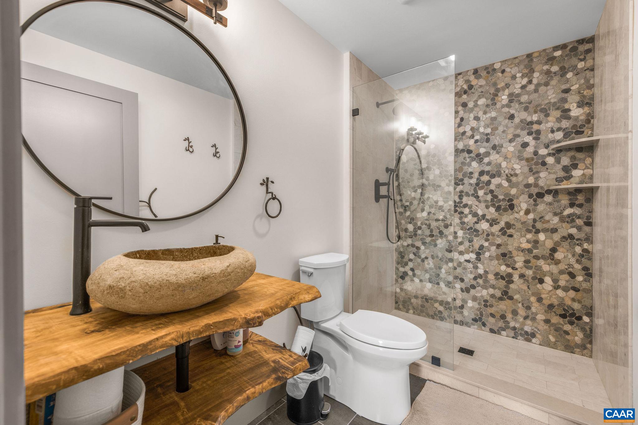 6288 Bryant Hollow Road Elkton, VA 22827 - Photo 34 of 54 a bathroom with a sink toilet and shower