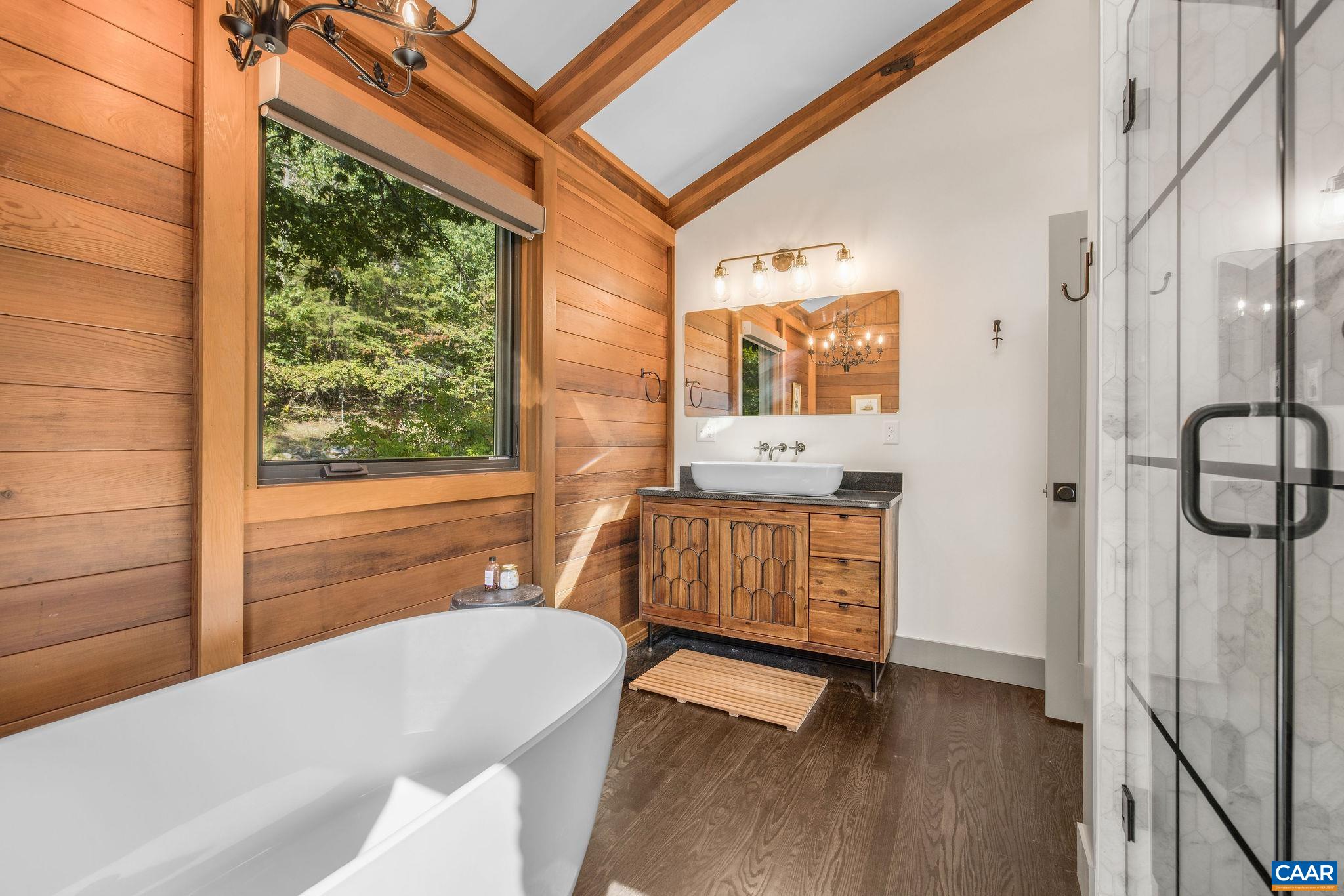 6288 Bryant Hollow Road Elkton, VA 22827 - Photo 36 of 54 a bathroom with a tub sink and window