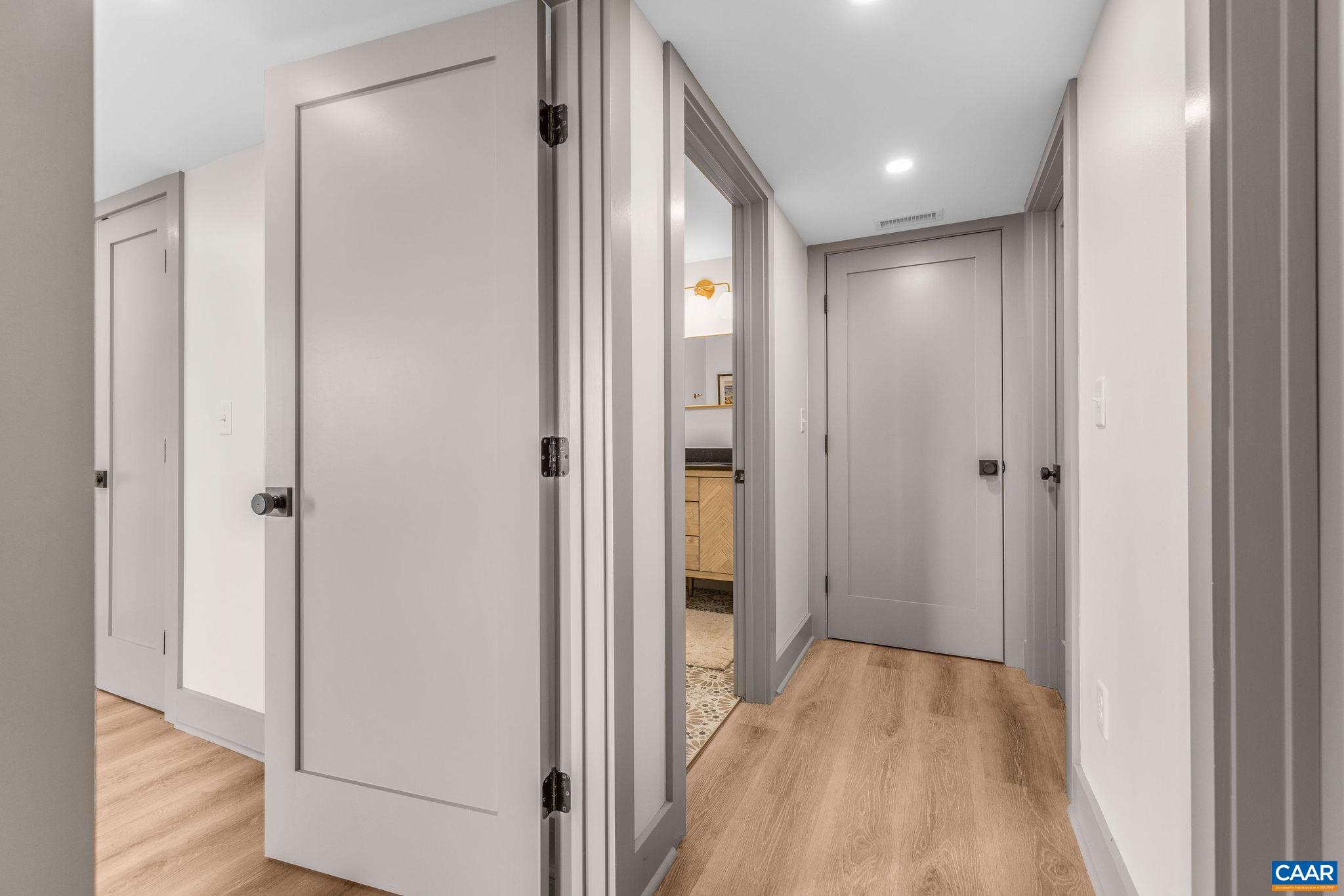 6288 Bryant Hollow Road Elkton, VA 22827 - Photo 39 of 54 a view of a hallway with wooden floor