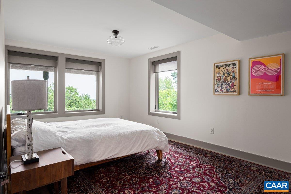 6288 Bryant Hollow Road Elkton, VA 22827 - Photo 40 of 54 a bed sitting in a bedroom next to a window