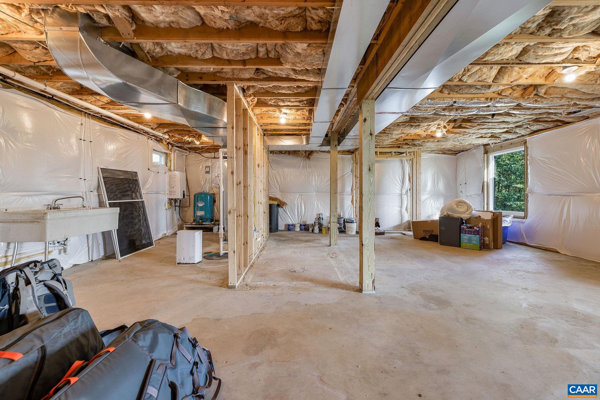 6288 Bryant Hollow Road Elkton, VA 22827 - Photo 44 of 54 a view of a livingroom with furniture and a garage