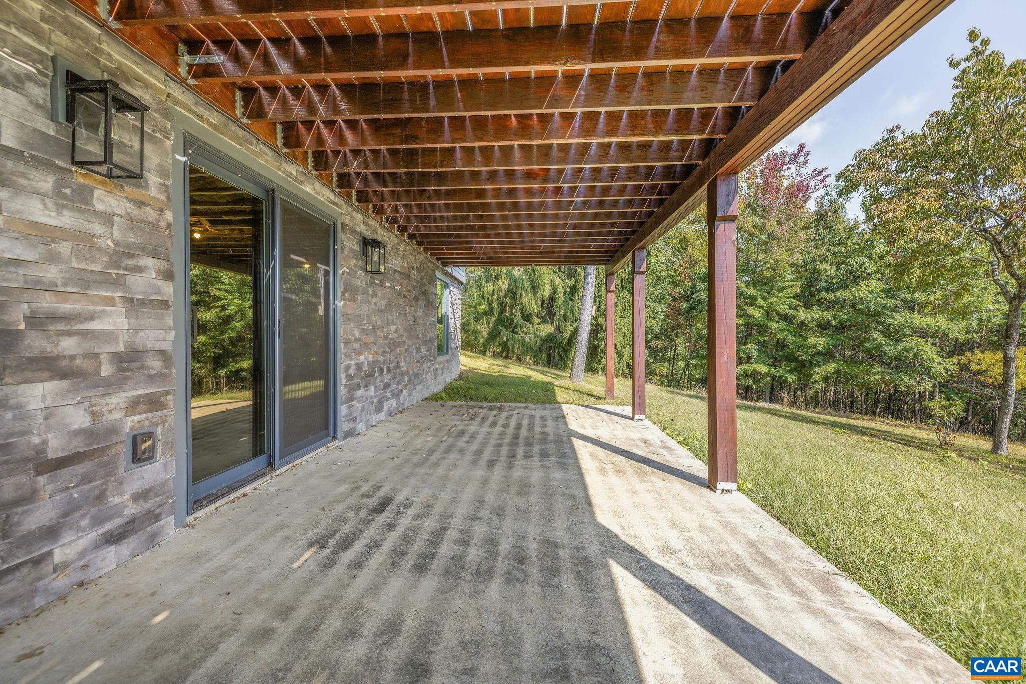 6288 Bryant Hollow Road Elkton, VA 22827 - Photo 45 of 54 a view of porch with wooden floor and outdoor space