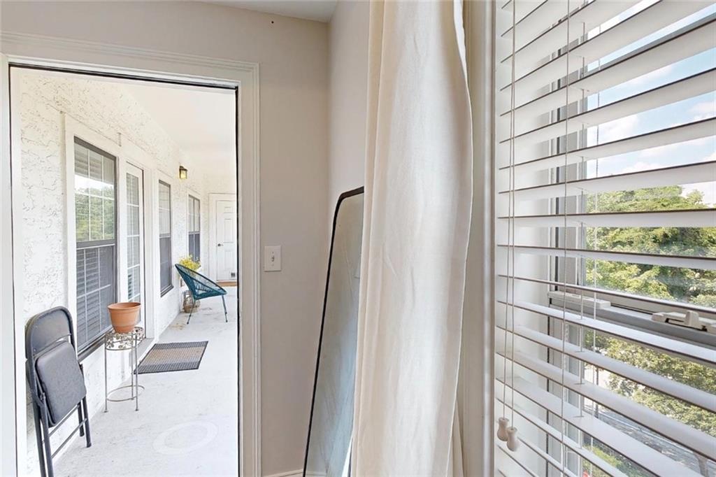 3275 Lenox Road Northeast, Unit 413 Atlanta, GA 30324 - Photo 20 of 52 a living room with furniture and a large window
