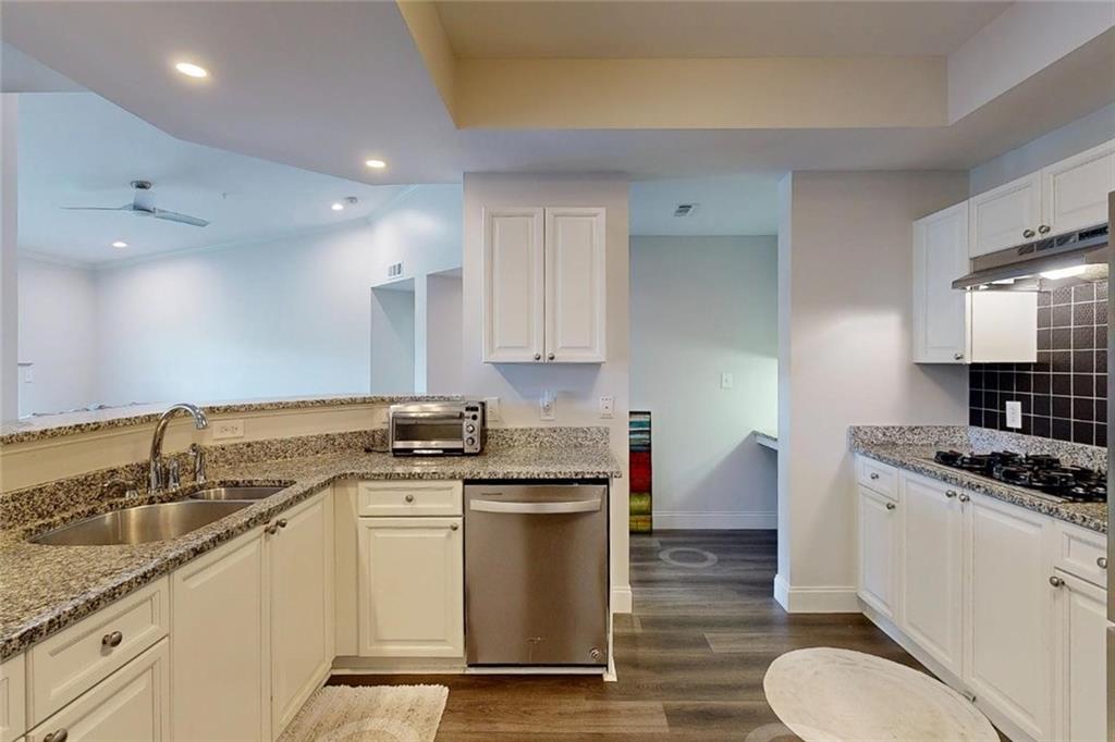 3275 Lenox Road Northeast, Unit 413 Atlanta, GA 30324 - Photo 29 of 52 a kitchen with a sink stove and cabinets