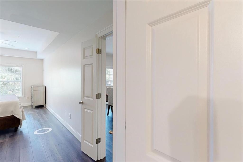 3275 Lenox Road Northeast, Unit 413 Atlanta, GA 30324 - Photo 36 of 52 a view of a room with wooden floor and windows