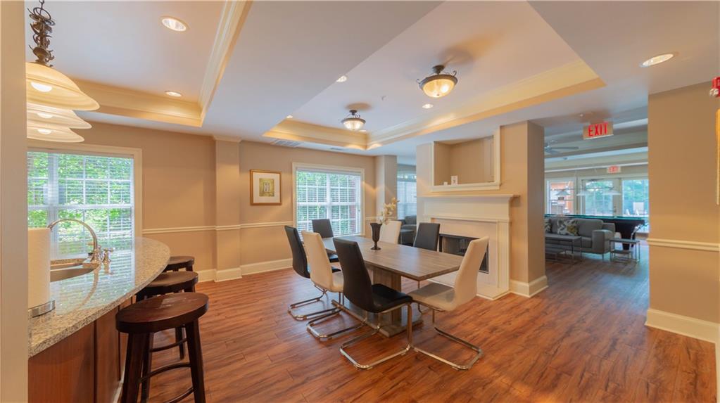 3275 Lenox Road Northeast, Unit 413 Atlanta, GA 30324 - Photo 42 of 52 a living room with furniture a large window and wooden floor
