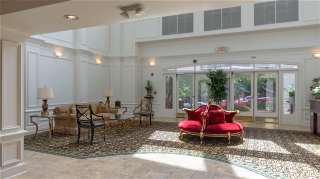 3275 Lenox Road Northeast, Unit 413 Atlanta, GA 30324 - Photo 50 of 52 a living room with furniture and window