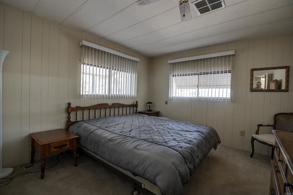 1010 Palm Canyon Drive, Unit 159 Borrego Springs, CA 92004 - Photo 14 of 25 a bed sitting in a bedroom next to a window