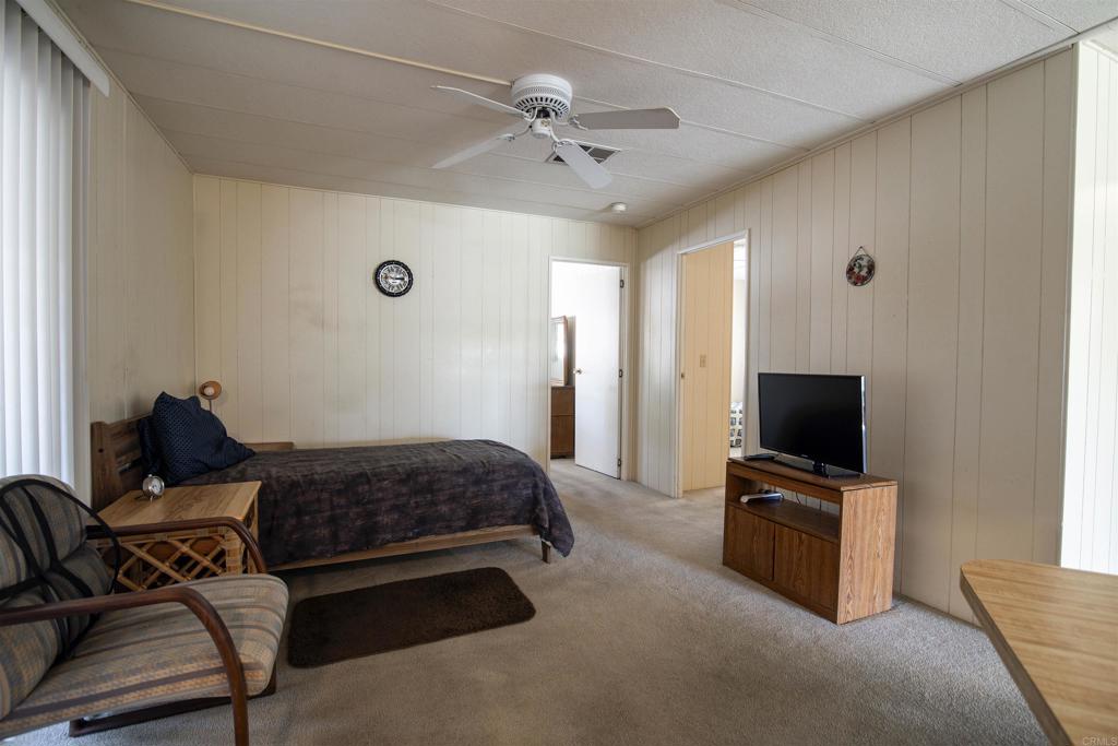1010 Palm Canyon Drive, Unit 159 Borrego Springs, CA 92004 - Photo 18 of 25 a living room with furniture and a flat screen tv