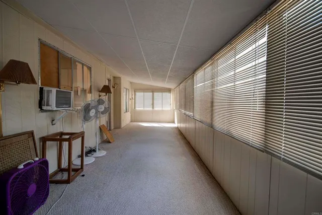 a view of a room with window and furniture