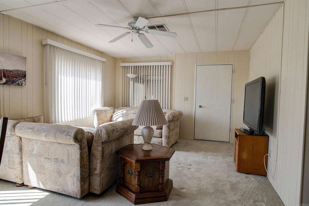 1010 Palm Canyon Drive, Unit 159 Borrego Springs, CA 92004 - Photo 5 of 25 a living room with furniture and a flat screen tv
