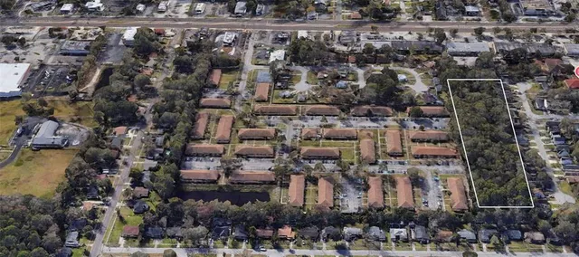 an aerial view of residential building with outdoor space