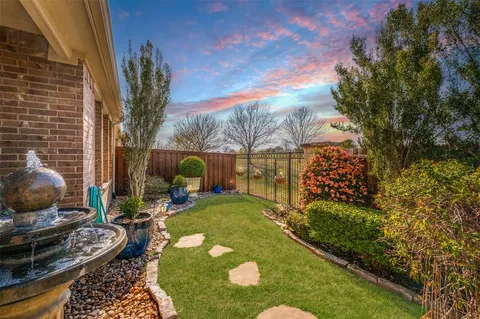 a view of a backyard with sitting area