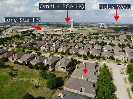 a view of a kitchen with fridge and window