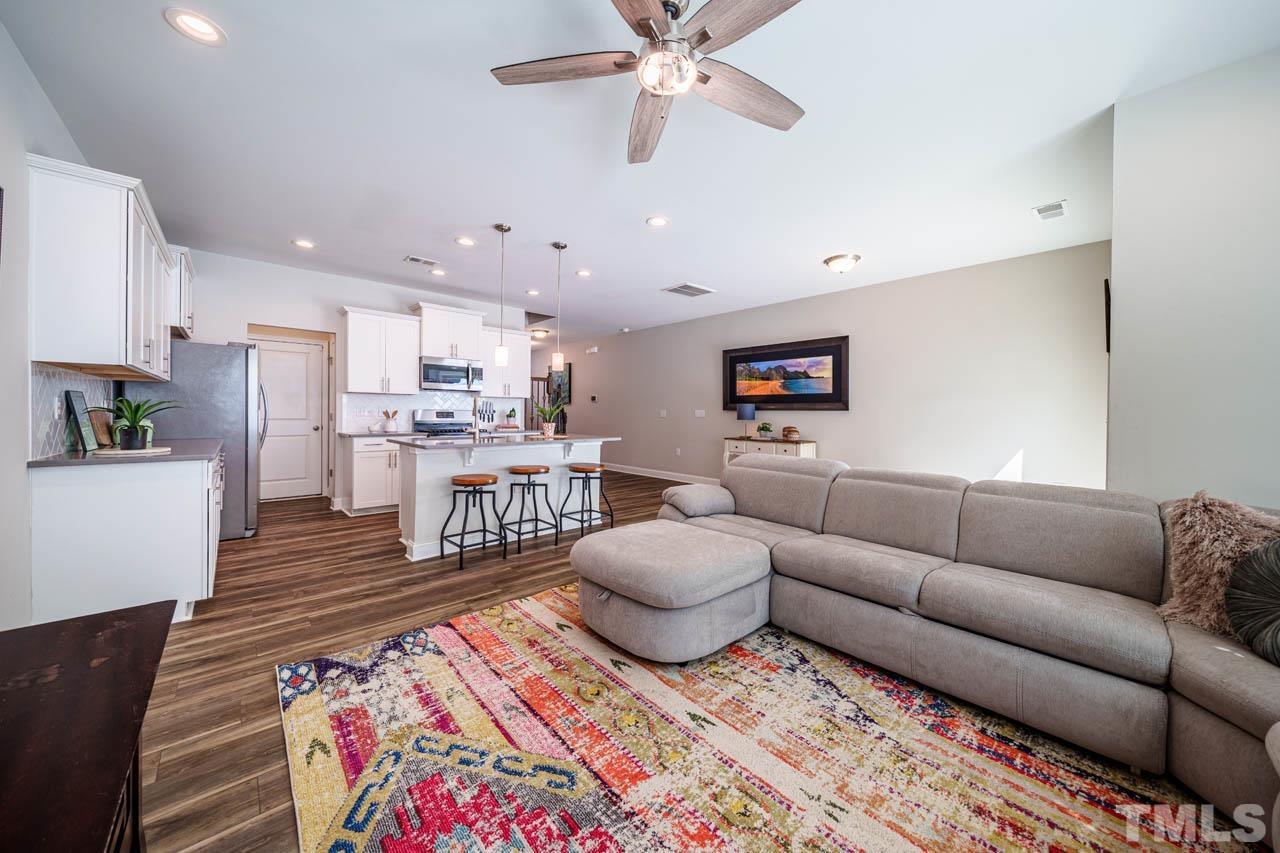 1007 Longitude Drive Durham, NC 27713 - Photo 15 of 35 a living room with furniture and a rug